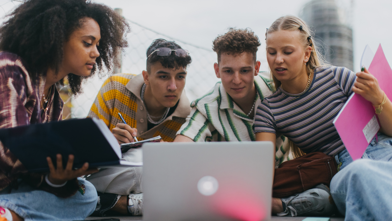 Friends looking up birth control information in a computer