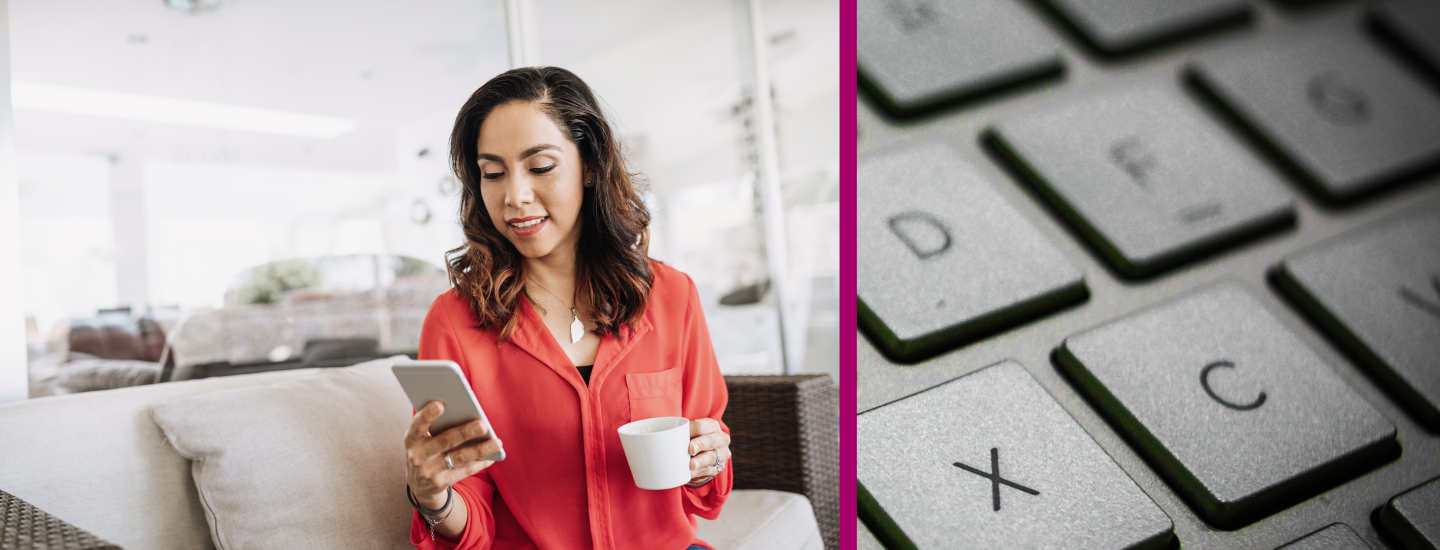 A Latina woman looks on her phone while holding a cup of coffee and an image of a keyboard. 