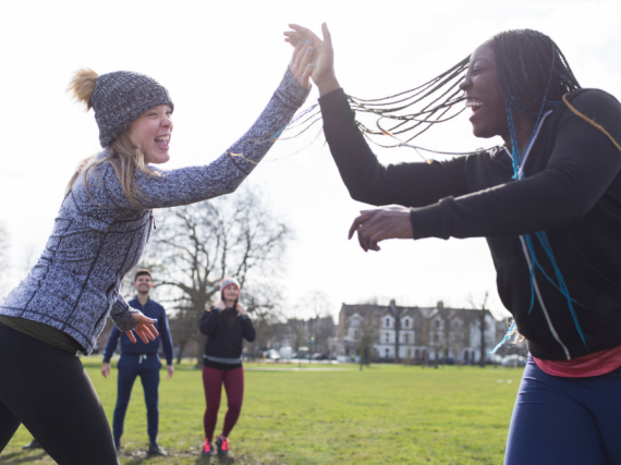 an image of two women high fiving
